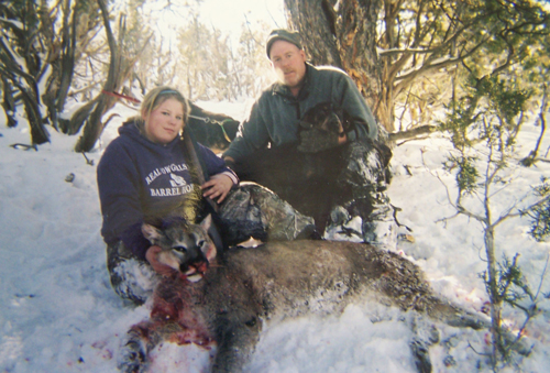 Michigan's Howard Hale and his daughter, Kelsey with a Lion she killed while hunting in Colorado