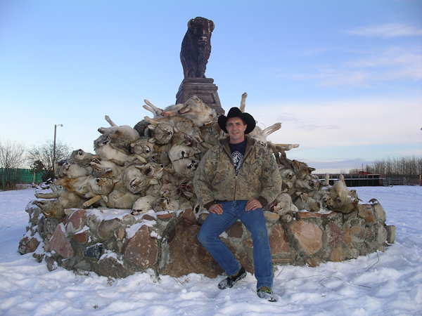Gordy Klassen, President of the Alberta Trappers Association, with a pile of canines