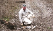 Cody Alphin with a nice spotted bobcat caught on a farm in Arkansas