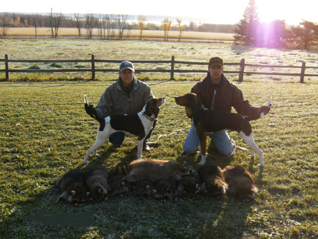 Gary and Vance with a good bunch of coon and a couple of fine hounds