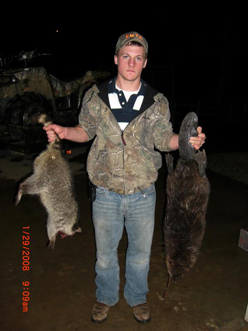 Levi holding a couple of rewards for his hard work