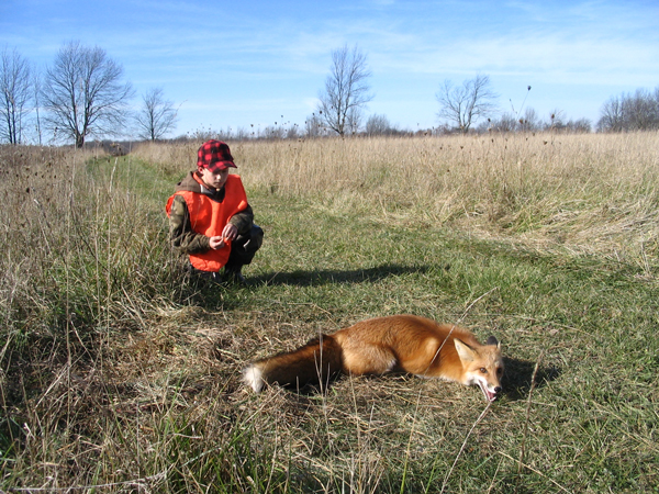 What a great photo of Zac Carl with his first Red Fox