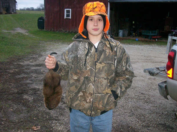 McLain Morehouse with one of his many muskrats he's caught this season