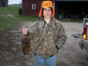 McLain Morehouse with one of his many muskrats he's caught this season