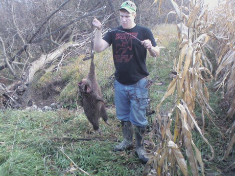 Bryce Spurgeon from Hastings, Michigan and his first coon, a nice 30 pound male.