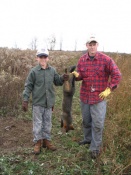 Michigan's Zac Carl and his dad Dave with Zac's first gray fox