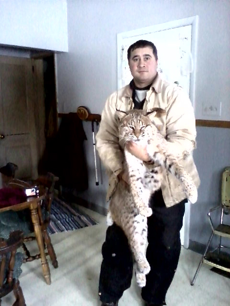 Steve Wilkowski with his first bobcat, a 37 pounder caught near Frazee, Minnesota
