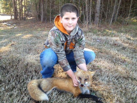 Isaac Jones, age 11, with his first red fox from Mathiston, MS