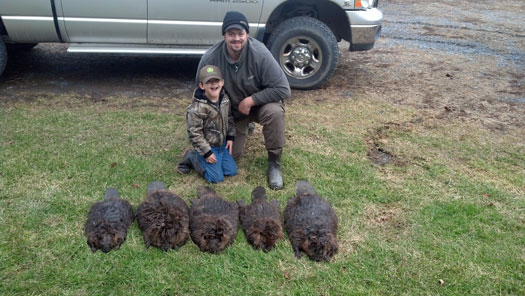 Drew Glenn and his 6 year old son, Charlie, after checking their first beaver line in Virginia.