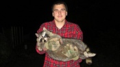 Ryan Bechtold with a nice big raccoon.