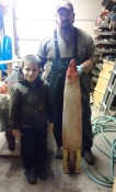 Jacob McMillon and his nephew with a nice big coon