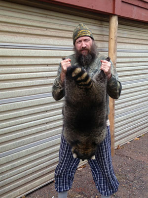 Lynn Sager with one of his many coons he caught during the season