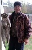 Thomas Harris form southern Louisiana with a coon caught in a dog proof trap