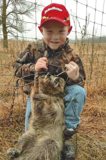 6 year old Dominic DeSmith of Sauk Centre, MN with one of his several catches in his first year of trapping