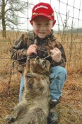 6 year old Dominic DeSmith of Sauk Centre, MN with one of his several catches in his first year of trapping