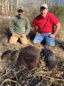 Mike and Garrett Hemric with a nice catch of fur in North Carolina