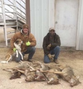Jesse Blumer and Dennis Junkins of Oklahoma with a good catch of coyotes