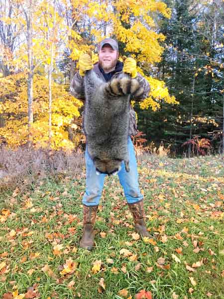 Corbin Grenier with a monster northern Wisconsin coon 