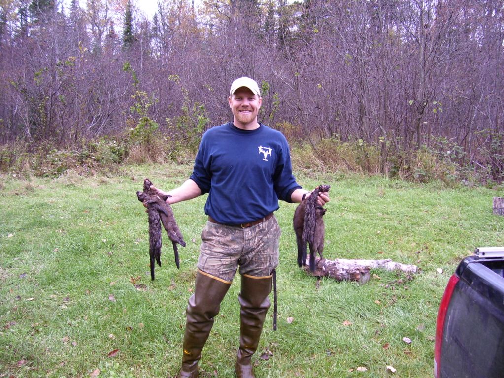 Jerremy Dunlap with a few mink caught in Michigan