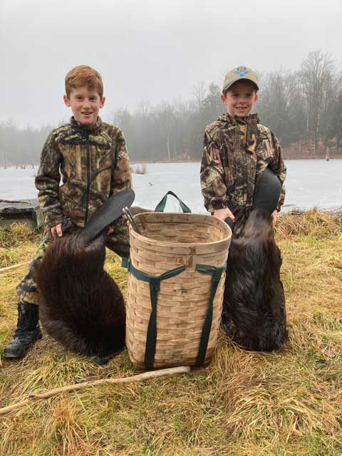 Luke and Cole Clemmer from Pennsylvania with two beavers