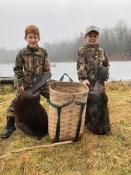 Luke and Cole Clemmer from Pennsylvania with two beavers