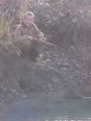 9 year old Treavor Kimes with his very first trapped coon