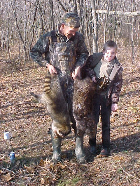 Missouri's Frankie and Treavor Kimes with a nice coon and beaver